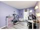 Inviting workout room featuring modern exercise equipment and a bright window view at 862 Centennial Way, Bennett, CO 80102