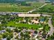 Aerial view of Louisville Community Park showcasing green spaces, walking paths, and ponds for outdoor recreation and leisure at 202 Hoover Ave, Louisville, CO 80027