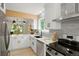 Stylish kitchen boasting quartz countertops, sleek appliances, and ample cabinet space at 202 Hoover Ave, Louisville, CO 80027