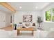 Sunlit living area showcasing modern decor, stylish furnishings, and a cozy atmosphere at 202 Hoover Ave, Louisville, CO 80027
