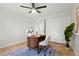 Bright home office with a modern desk, a patterned rug, and a storage closet at 202 Hoover Ave, Louisville, CO 80027