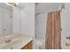 Bathroom features shower and tub combo and wood vanity at 11115 E Alameda Ave # 203, Aurora, CO 80012