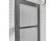 A front door with glass features and a door knob and number 203 at 11115 E Alameda Ave # 203, Aurora, CO 80012