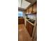 Kitchen featuring laminate countertops, oak cabinetry, and stainless steel sink at 11115 E Alameda Ave # 203, Aurora, CO 80012