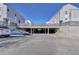 Exterior view of the parking area situated beneath the buildings with ample space for vehicles at 11115 E Alameda Ave # 203, Aurora, CO 80012
