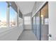 A bright porch with many windows and a sliding glass door at 11115 E Alameda Ave # 203, Aurora, CO 80012