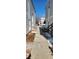 Exterior view of a walkway between residential buildings on a sunny day with a blue sky at 11115 E Alameda Ave # 203, Aurora, CO 80012