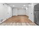 Open basement with new flooring, great for entertaining or storage at 5140 W 9Th Ave, Denver, CO 80204