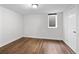 Cozy basement bedroom with natural light and wood-look floors at 5140 W 9Th Ave, Denver, CO 80204