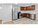 Modern basement kitchenette with stainless steel appliances at 5140 W 9Th Ave, Denver, CO 80204