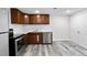 Well-lit basement kitchenette with modern appliances at 5140 W 9Th Ave, Denver, CO 80204