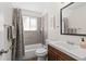 Cozy bathroom with a shower and bathtub, wood like flooring, and a vanity at 5140 W 9Th Ave, Denver, CO 80204