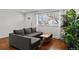 Comfortable living room with a sectional couch, a window and lots of natural light at 5140 W 9Th Ave, Denver, CO 80204