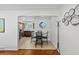 Bright living room showcasing hardwood floors, recessed lighting, and seamless flow to the dining area and kitchen at 5140 W 9Th Ave, Denver, CO 80204