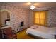 Bedroom with patterned wallpaper, ceiling fan, and bright yellow window curtain at 7250 County Road 5, Erie, CO 80516