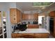 A functional kitchen design featuring wooden cabinets, a ceiling fan, and ample counter space at 7250 County Road 5, Erie, CO 80516