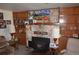 Cozy living room featuring a stone fireplace and built-in shelving, perfect for displaying decor at 7250 County Road 5, Erie, CO 80516