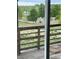 View from wooden deck overlooking grassy field, walking path and a green play area for  at 4812 S Bahama Way, Aurora, CO 80015