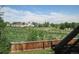 View from the back of property overlooking expansive grassy field, play area and residential homes at 4812 S Bahama Way, Aurora, CO 80015