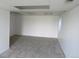 Finished basement with carpet flooring, drop ceiling, and bright white walls at 4812 S Bahama Way, Aurora, CO 80015