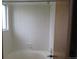 Shower and bathtub area, including tiled walls and a small window at 4812 S Bahama Way, Aurora, CO 80015
