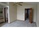 Spacious bedroom with neutral carpet, a ceiling fan, and a closet at 4812 S Bahama Way, Aurora, CO 80015