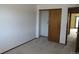 Bedroom with neutral carpet, sliding closet door, and base trim at 4812 S Bahama Way, Aurora, CO 80015