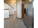 Light-filled entryway with tile floors, staircase and stainless steel refrigerator at 4812 S Bahama Way, Aurora, CO 80015