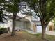 Charming two-story home with light siding, landscaped front yard, and an attached two car garage at 4812 S Bahama Way, Aurora, CO 80015