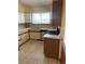 Functional kitchen with a double sink, modern appliances, and a bright window view at 4812 S Bahama Way, Aurora, CO 80015