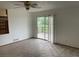 Bright living room featuring access to a deck and ample natural light at 4812 S Bahama Way, Aurora, CO 80015
