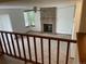Cozy living room featuring a brick fireplace, a ceiling fan, and large windows for ample light at 4812 S Bahama Way, Aurora, CO 80015