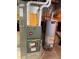 Utility room featuring Rheem furnace and hot water heater at 4812 S Bahama Way, Aurora, CO 80015
