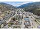 Aerial view of the property in a mountain town setting, nestled amidst stunning natural beauty, with an ideal location at 1104 Miner St, Idaho Springs, CO 80452