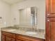 Bathroom vanity featuring double sinks, granite countertops, and ample storage at 1104 Miner St, Idaho Springs, CO 80452