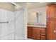 Bathroom with a glass-enclosed shower and a vanity featuring ample storage space at 1104 Miner St, Idaho Springs, CO 80452