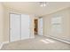 Cozy bedroom features neutral carpet, large closet, a baseboard heater, and a view to another room at 1104 Miner St, Idaho Springs, CO 80452