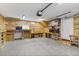 Organized garage featuring ample storage, built-in shelving, and workspace at 1104 Miner St, Idaho Springs, CO 80452