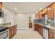 Charming kitchen featuring granite counters, tile floors, and wood cabinetry at 1104 Miner St, Idaho Springs, CO 80452