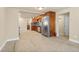 Open kitchen and dining area with updated stainless steel appliances and tile flooring at 1104 Miner St, Idaho Springs, CO 80452