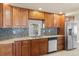 Charming kitchen featuring wood cabinets, granite countertops, stainless steel appliances, and a modern design at 1104 Miner St, Idaho Springs, CO 80452