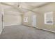 Spacious living room features vaulted ceiling, neutral carpet, and bright windows at 1104 Miner St, Idaho Springs, CO 80452
