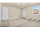 Spacious living room featuring carpet, a window view, and a bright and airy atmosphere at 1104 Miner St, Idaho Springs, CO 80452