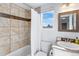 Cozy bathroom featuring a tiled shower/tub combination and a sink with a granite-look countertop at 13124 Tejon St, Westminster, CO 80234