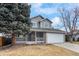 Charming two-story home featuring a stone-accented facade, covered porch, and attached two-car garage at 13124 Tejon St, Westminster, CO 80234