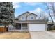 Charming two-story home featuring a stone-accented facade, covered porch, and attached two-car garage at 13124 Tejon St, Westminster, CO 80234