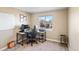 Neutral home office with large window, desk setup, and comfortable office chair at 13124 Tejon St, Westminster, CO 80234