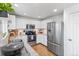 Beautiful kitchen featuring stainless steel appliances, granite countertops, and white cabinets at 13124 Tejon St, Westminster, CO 80234