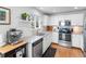 Bright kitchen features stainless steel appliances, granite countertops, and white cabinets at 13124 Tejon St, Westminster, CO 80234