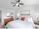 Spacious main bedroom with soft natural light, ceiling fan, and light colored carpet at 13124 Tejon St, Westminster, CO 80234